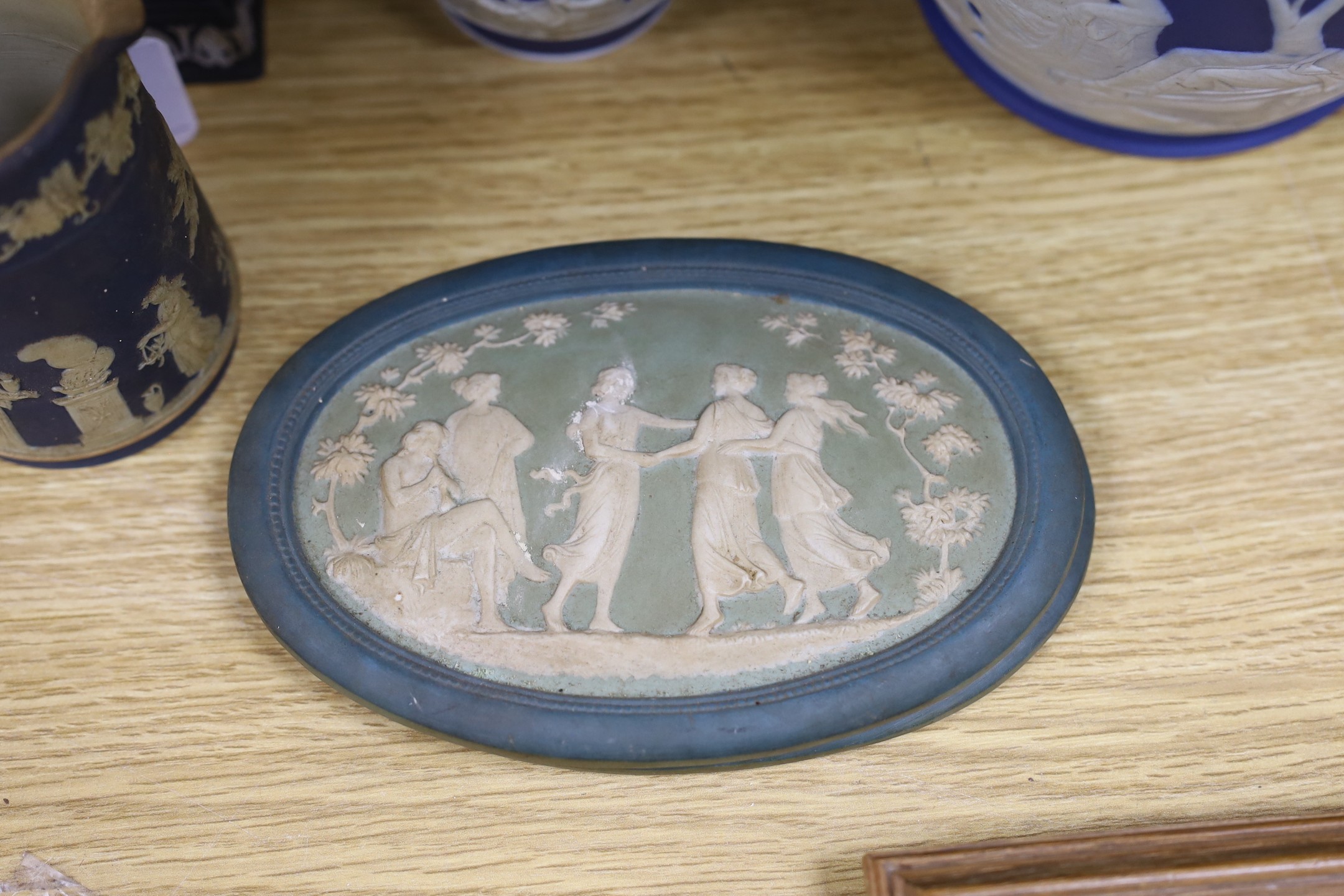 A collection of Victorian and later Jasperware, including a 19th century Wedgwood version of the Portland vase, 23 cms high